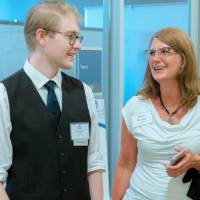 A guest and a student talking at the Engineering Design Project Preview